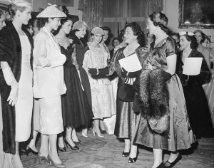 (Original Caption) Queen Mother and "Meg" at royal fashion show. London, England: Queen Mother Elizabeth and her daughter Princess Margaret were guests of honor at the annual show of London fashion designers, held on Wednesday. Here Lady Pamela Berry, (second from right) president of the Society of London Fashion Designers, escorts the princess (right) and the Queen Mother among the models for a close view of some of the clothes specially designed for the occasion. The affair was held at the Carlton House Terrace home of Viscountess Camrose.