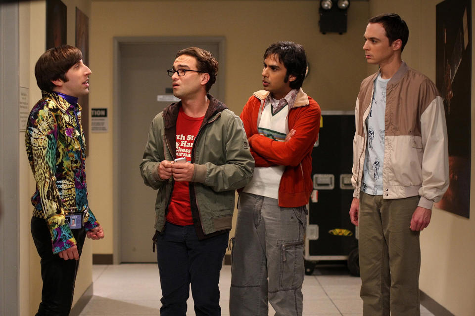 Simon Helberg, Johnny Galecki, Kunal Nayyar, and Jim Parsons are in character as Howard, Leonard, Raj, and Sheldon from The Big Bang Theory, standing and talking