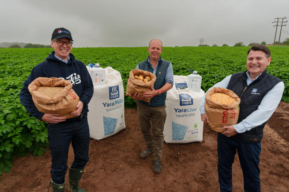 From left to right: David Wilkinson, Vice President, Market Supply Officer (PepsiCo), Jake Rice, General Manager (Strawsons Limited) and Cleofe Masala, Director, Sustainability & Food Value Chain (Yara) with PepsiCo and Yara products included in the partnership.