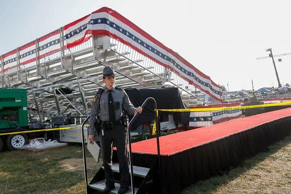 BUTLER, PENNSYLVANIA - JULY 13: Law enforcement agents stand near the stage of a campaign rally for Republican presidential candidate former President Donald Trump on July 13, 2024 in Butler, Pennsylvania. According to Butler County District Attorney Richard Goldinger, the suspected gunman is dead after injuring former President Trump, killing one audience member and injuring at least one other. (Photo by Anna Moneymaker/Getty Images)