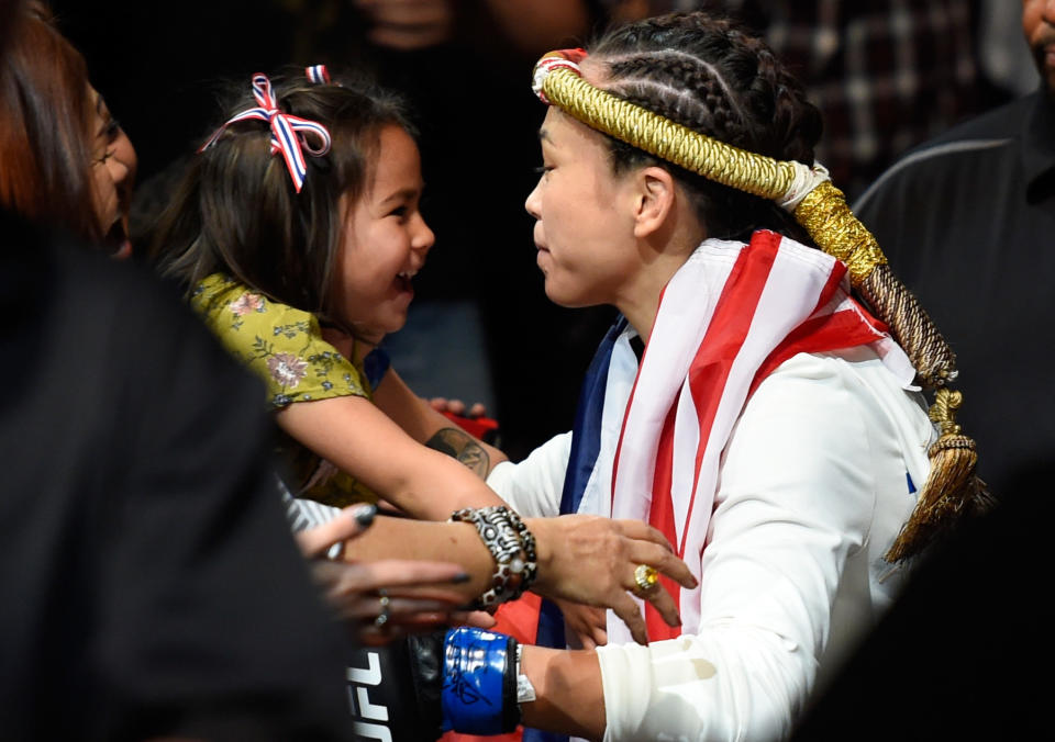 KANSAS CITY, MO - APRIL 15: Michelle Waterson kisses her daughter Araya Waterson before entering the Octagon during the UFC Fight Night event at Sprint Center on April 15, 2017 in Kansas City, Missouri. (Photo by Josh Hedges/Zuffa LLC/Zuffa LLC via Getty Images)