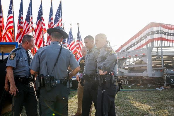 BUTLER, PENNSYLVANIA - JULY 13: Law enforcement agents stand near the stage of a campaign rally for Republican presidential candidate former President Donald Trump on July 13, 2024 in Butler, Pennsylvania. According to Butler County District Attorney Richard Goldinger, the suspected gunman is dead after injuring former President Trump, killing one audience member and injuring at least one other. (Photo by Anna Moneymaker/Getty Images)