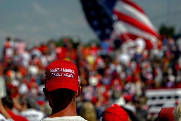 BUTLER, PENNSYLVANIA - JULY 13: Supporters of Republican presidential candidate, former U.S President Donald Trump wait for the start of a campaign rally at Butler Farm Show Inc. on July 13, 2024 in Butler, Pennsylvania. Shortly after Trump began to speak, shots rang out and the former president slumped before being whisked away by Secret Service with injuries visible to the side of his head. Butler County district attorney Richard Goldinger said that the shooter and one audience member are dead and another was injured. (Photo by Jeff Swensen/Getty Images)