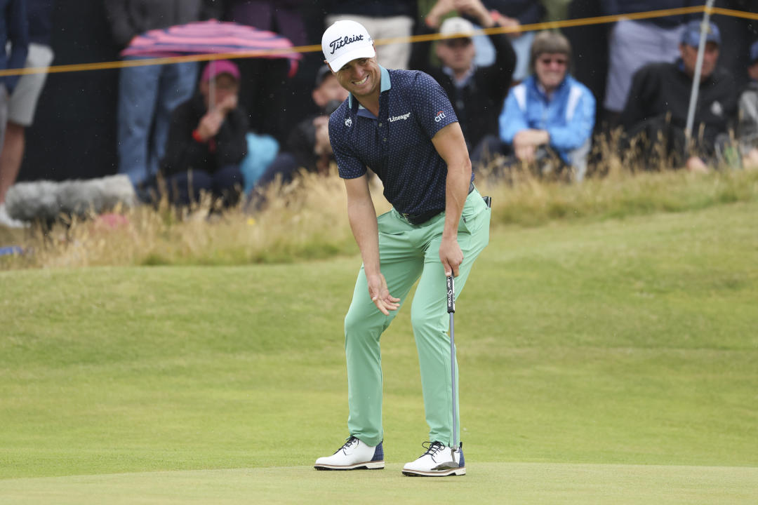 Justin Thomas of the United States reacts to his putt on the 14th green during his third round of the British Open Golf Championships at Royal Troon golf club in Troon, Scotland, Saturday, July 20, 2024. (AP Photo/Peter Morrison)