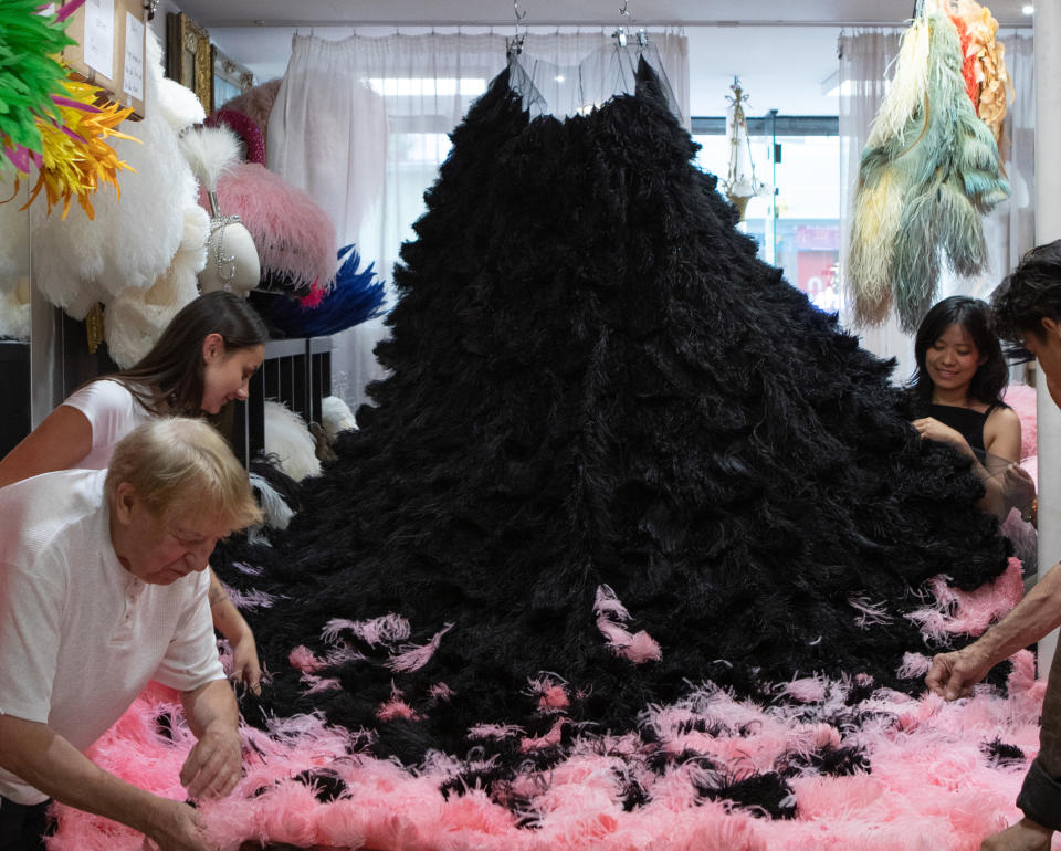 The Dior team working on Lady Gaga's outfit.